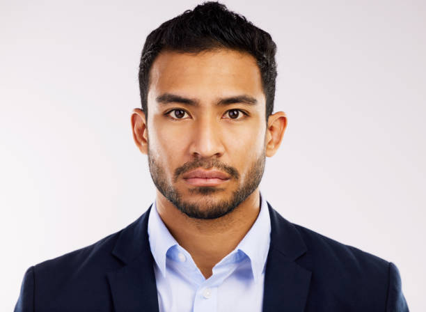 istock Studio shot of a serious young man posing against a grey background 1355110834