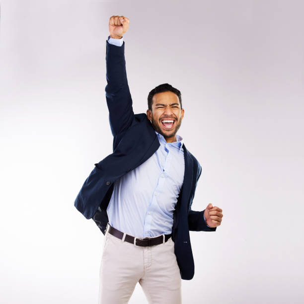 istock Studio shot of a handsome young man cheering against a grey background 1355110849
