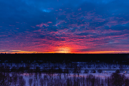 Bright sunset with colorful clouds over the horizon in the evening, Russia