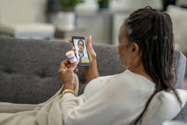 istock Senior Woman in a Virtual Doctors Appointment 1355116202