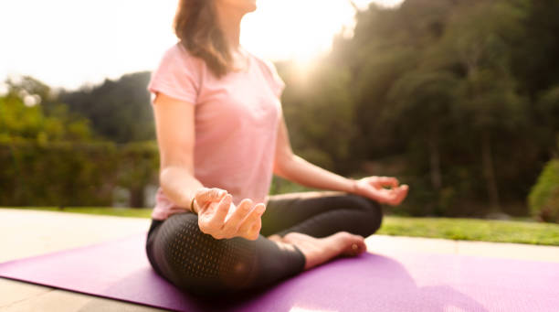 istock Woman meditating in her backyard on a sunny afternoon 1355116445