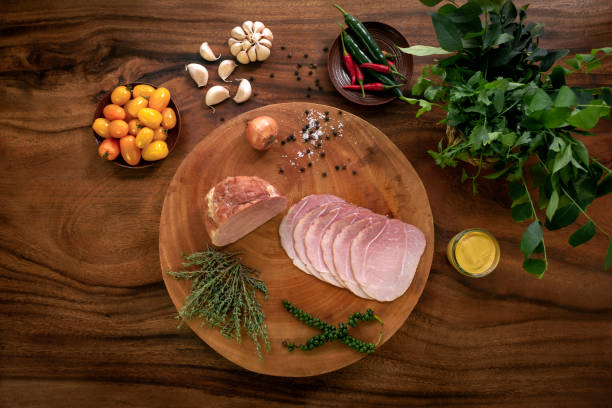 istock smoked ham on rustic wood table with natural ingredients arrangement 1355119657