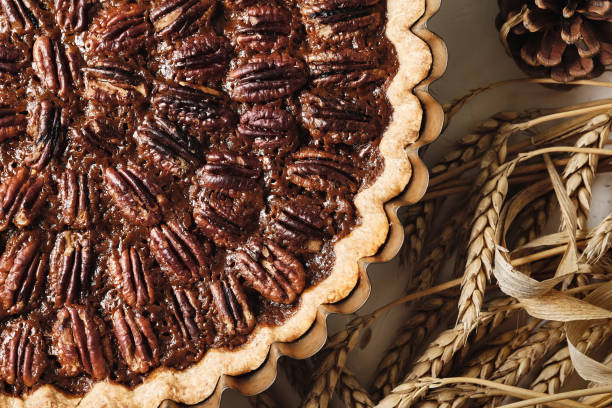 Baking dish with tasty pecan pie on table, closeup. Traditional holiday dessert for Thanksgiving or Christmas stock photo