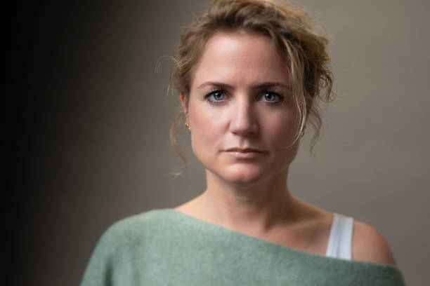 istock Young woman studio portrait 1355120451