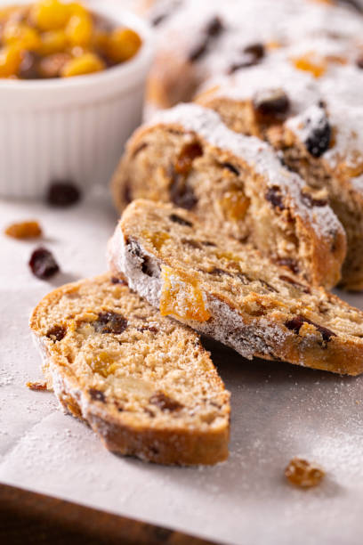 Traditional German stollen Christmas / holiday bread with candied fruit and and powdered sugar