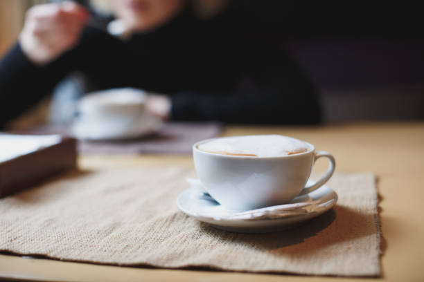 istock Beautiful Woman Drinking Coffee 1355122291