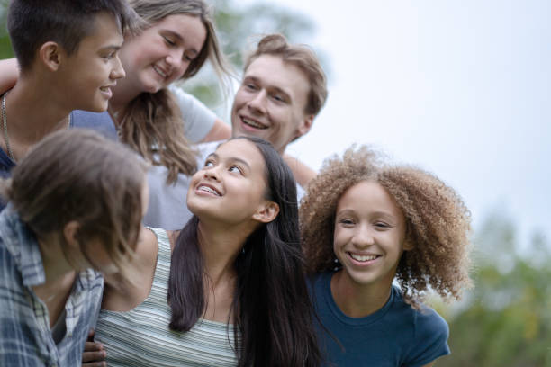 istock Teens Hanging Out on Break Outside 1355122336