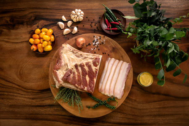 istock smoked fatty bacon on rustic wood table with natural ingredients arrangement 1355124000
