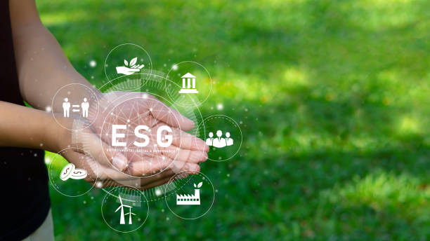 istock Young professionals ready to use the technology of ESG renewable resources to reduce pollution in the icon concept ESG in hand for the environment, society and sustainable business governance. 1355124036