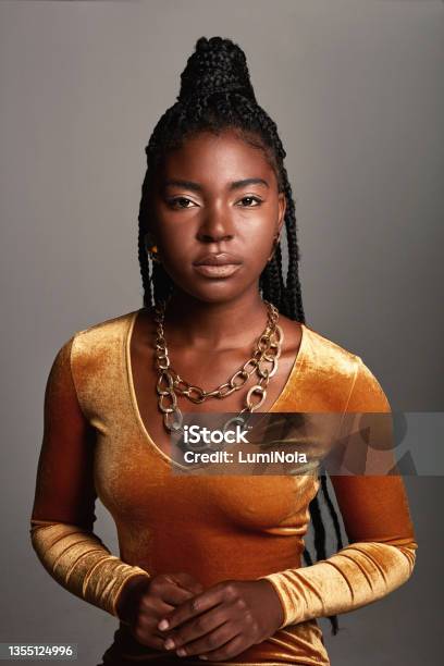 Shot Of A Beautiful Young Woman Posing Against A Grey Background Stock Photo - Download Image Now