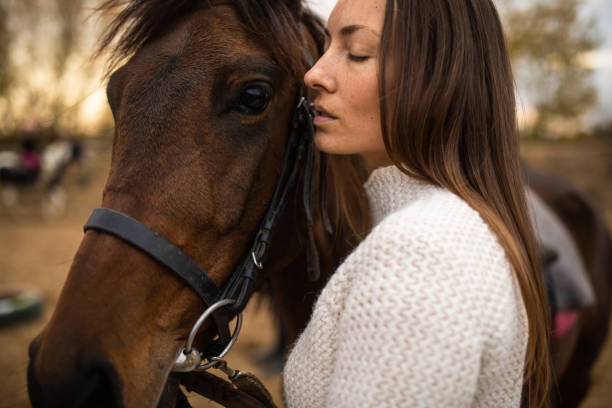 istock A female equestrian affectionate toward her horse 1355127543