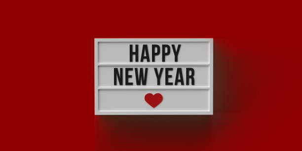 istock Happy New Year text and heart symbol on red 1355127627