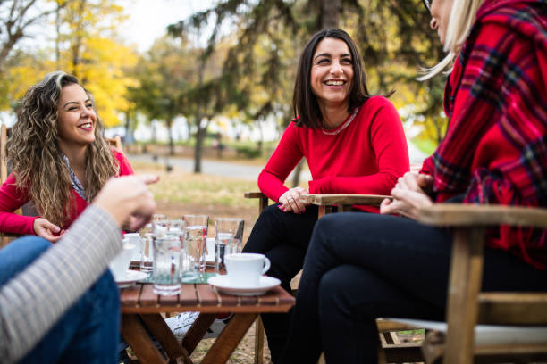 istock Happy women having coffee 1355129158