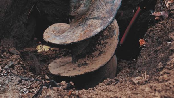 istock Heavy Duty Industrial Earthworks Machine Drill Rotating Excavating Ground 1355131655
