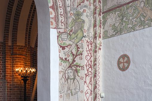 Roskilde, Denmark - December 14, 2015: Frescoes painted in the beginning of the 1500s in St. Birgitta's Chapel of Roskilde Cathedral. The chapel is named arter St. Bridget of Sweden, founder of Bridgettine Order.