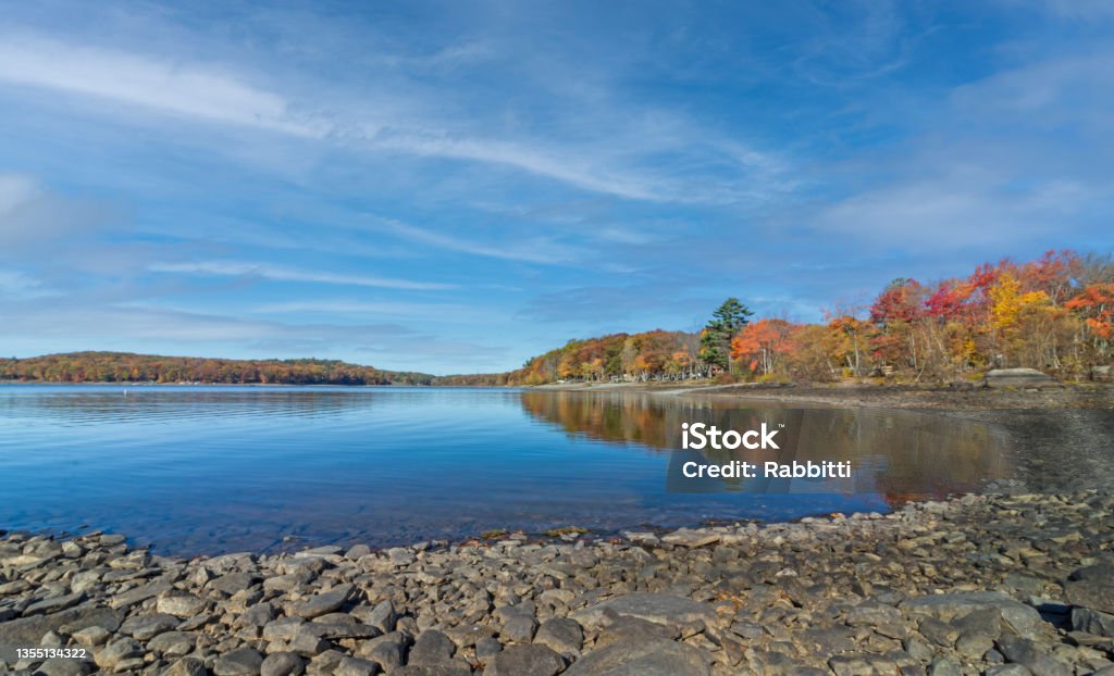 Lake Wallenpaupack in Poconos PA on a bright fall day lined with trees in vivid and beautiful foliage Lake Wallenpaupack in Poconos PA on a bright autumn day lined with trees in vivid and beautiful foliage Pocono Mountains Region Stock Photo