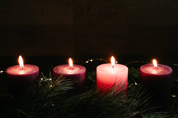 istock Four advent candles in the dark 1355135263