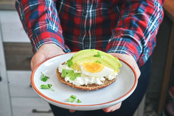 istock Avocado Sandwich with Brown Bread, Cottage Cheese and Boiled Eggs 1355135560