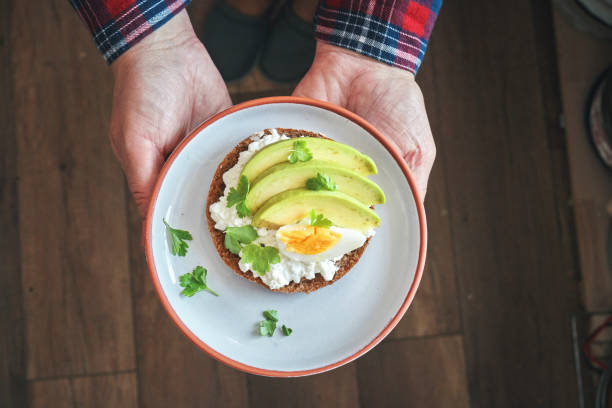 istock Avocado Sandwich with Brown Bread, Cottage Cheese and Boiled Eggs 1355135561