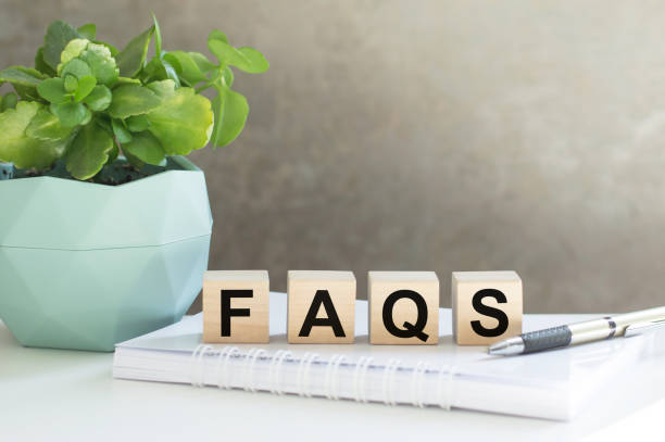 istock Faqs concept with wooden block on office table 1355135861