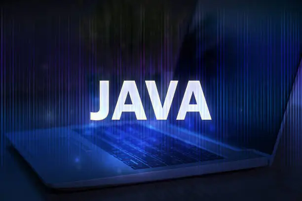 Photo of Java text on blue technology background with laptop.