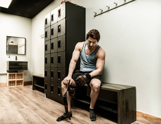 istock Young Man resting in the locker room 1355138925