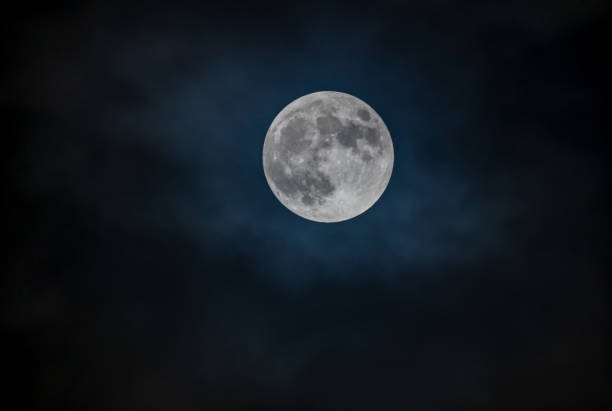 istock Full moon against the night sky 1355140351