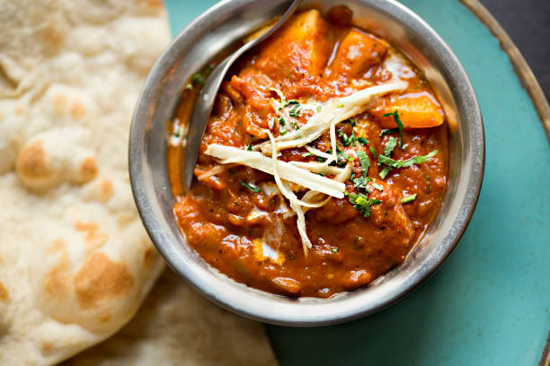 istock Masala paneer cheese curry with indian flatbread 1355140605
