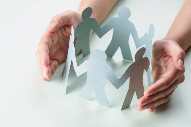 istock Hand Protecting Paper Cut Out Figure 1355141200