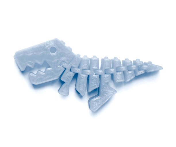 istock Bright light pink object in shape of dinosaur toy printed on 3d printer 1355143406