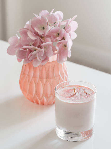 istock The candle on the table next to the rose bouquet 1355144704