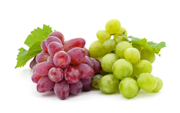 istock Green grapes with leaves. 1355144950