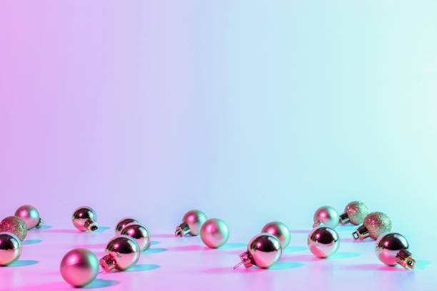 istock Christmas balls pattern neon background. Xmas bauble on abstract holiday winter gradient backdrop. Happy new year copy space. 1355147388