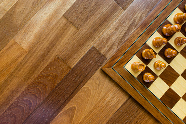 Overhead image of a chess board. Overhead image of a chess board on a wooden floor with copy space. chess timer stock pictures, royalty-free photos & images