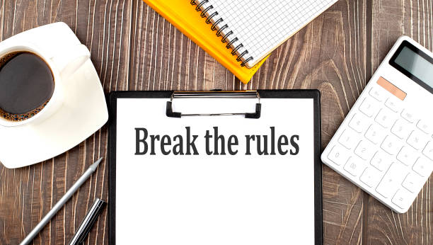 istock BREAK THE RULES text on paper with coffee, calculator and notebook. Business concept 1355150472