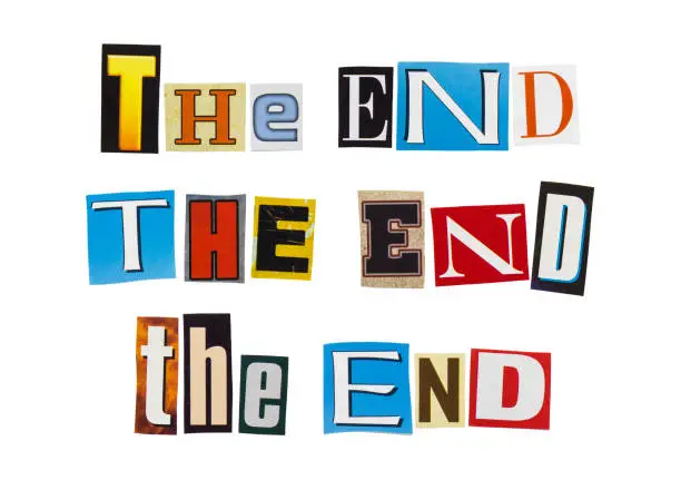 Photo of THE END - phrase from cutting magazine clippings isolated on white background. Ending and finishing concept.