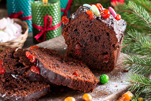 Christmas fruit cake with Christmas cake on old wooden background