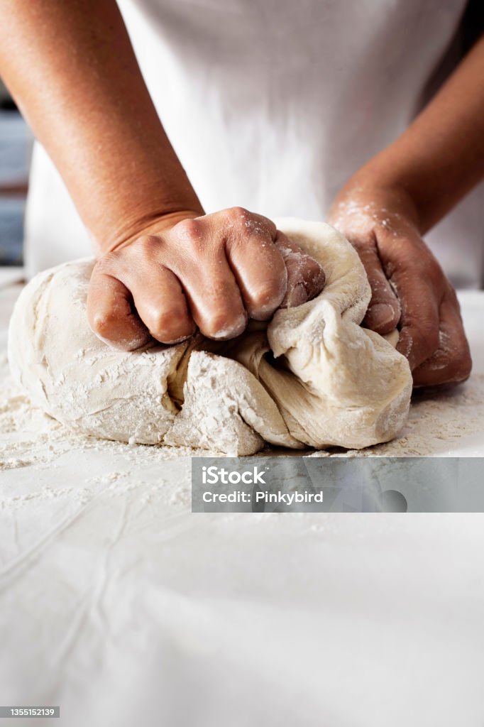 Making yeast dough, Hands knead dough, Kneading dough Dough, Pizza, Bread, Yeast, Kneading, Pastry Dough,  Flour, Food and drink, kitchen, cooking, cuisine Pizza Stock Photo
