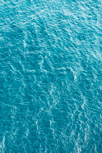 Blue turquoise sea water background. Aerial view.