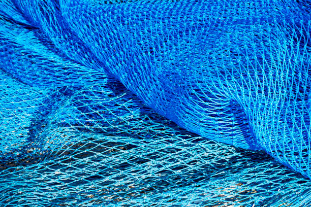 kommerzielle blaue farbe fischernetze hintergrund. draufsicht - nylon stock-fotos und bilder