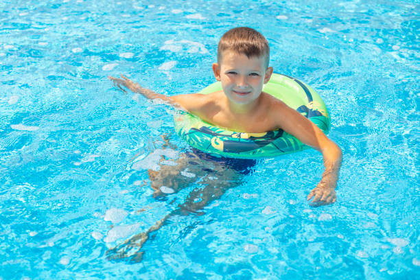 Senior man full with life spending time in Water Park with his grandson