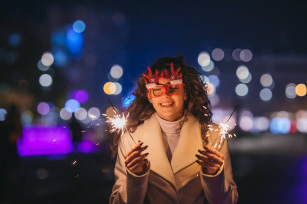istock A young woman with burning sparklers in town 1355158200