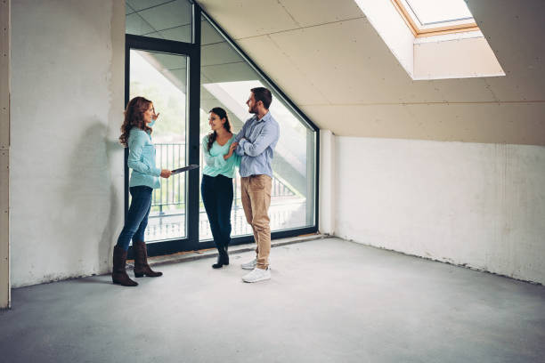istock Property agent showing apartment for sale 1355159600