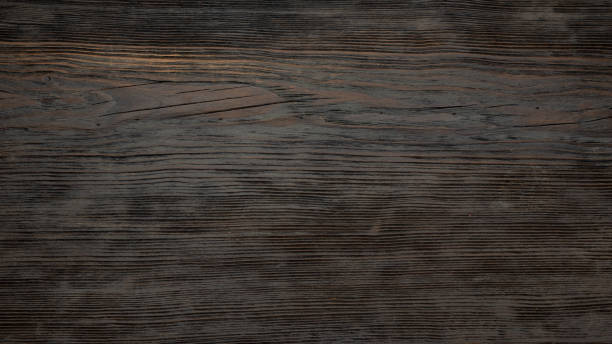 istock Dark old wooden table texture background top view 1355159749