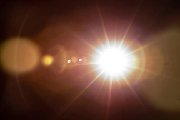 istock Sun flare on the black background 1355160028