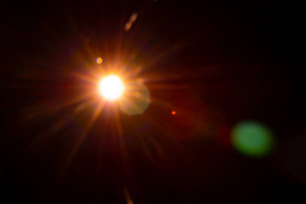 istock Sun flare on the black background 1355161364