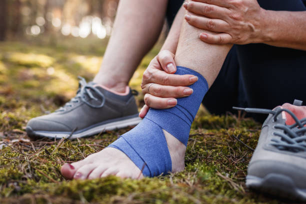 istock Sprain ankle with bandage during hiking in nature 1355161569