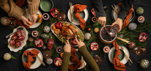 istock People feasting with chicken and hot wine at table 1355162181