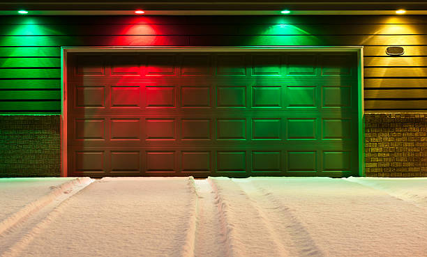 Multi-Colored Garage Door and Snowy Driveway stock photo
