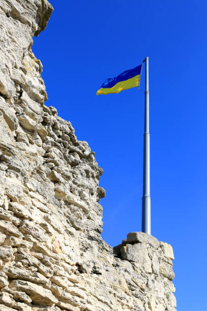 istock Ukrainian flag over stone ruins 1355162560